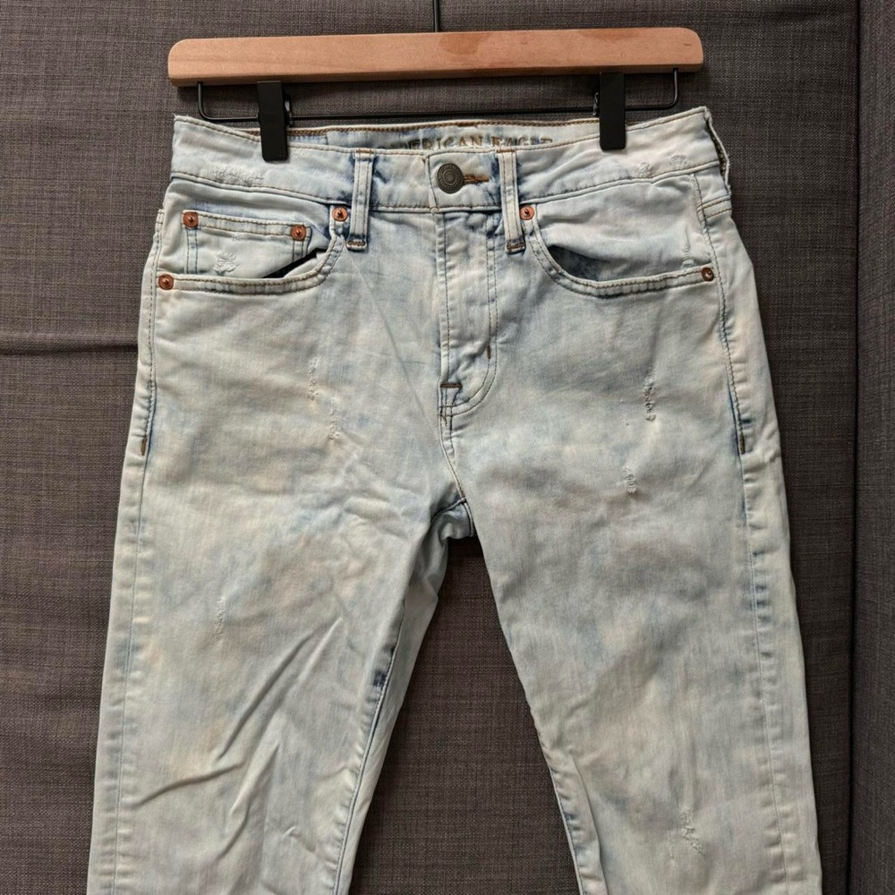 Acid wash jeans with distressed marks